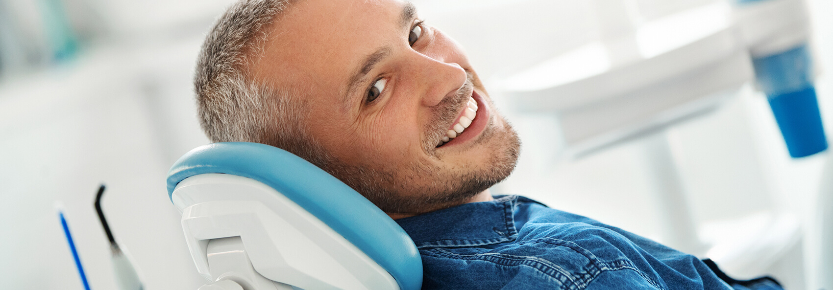 smiling man at a dental office at dentist in hermitage