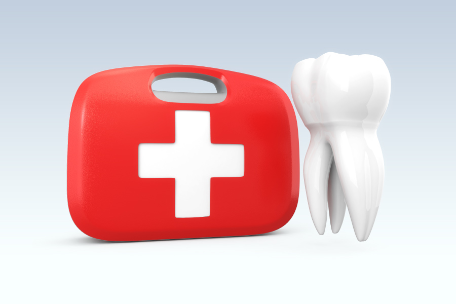 A first aid kit next to a floating white tooth to indicate a dental emergency at dentist in hermitage