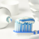 A toothbrush loaded with fluoride toothpaste.