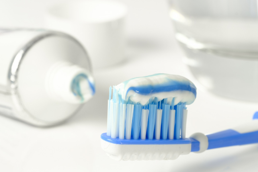 A toothbrush loaded with fluoride toothpaste.