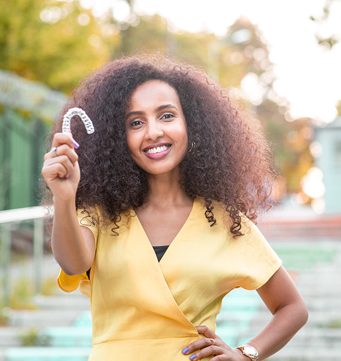 woman with clear aligner