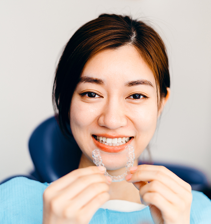 woman with clear aligner