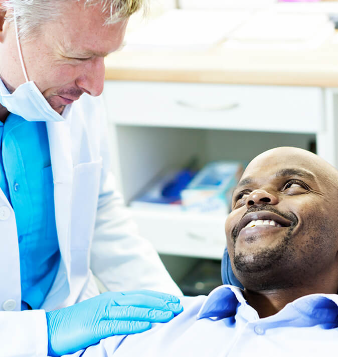 dentist comforting a patient