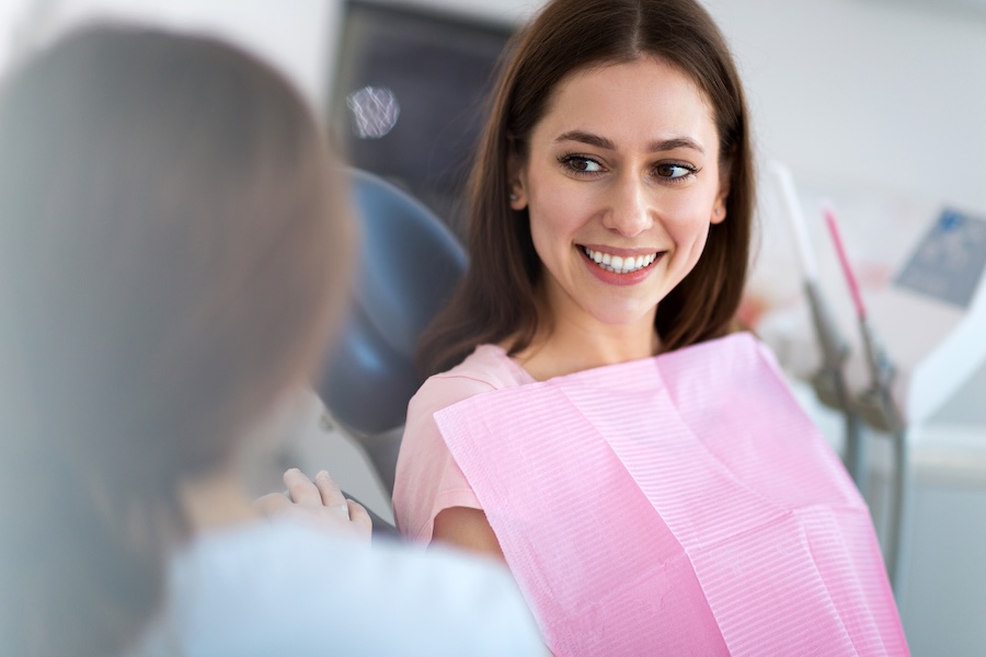 woman in dental chair discussing cosmetic dentistry options in Hermitage, TN