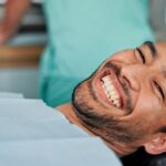 man at dentist for dental cleaning and exam